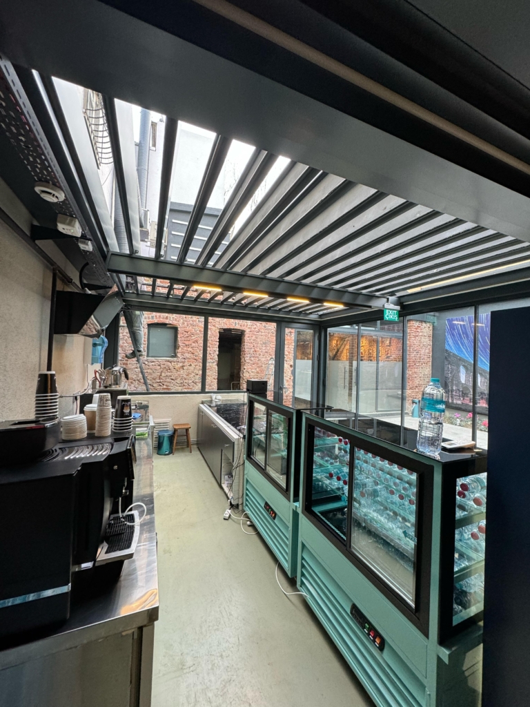 Completed Skytech Pergola project over a commercial outdoor area